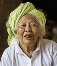 Bali, Indonesia, June 1, 2022 - Old woman with black teeth looks at camera