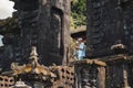 26.12.2018, Bali, Indonesia. A man stands at the entrance to the temple. Bali temple close-up. Indonesian ancient Architecture Royalty Free Stock Photo