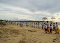 Bali, Indonesia - March 08, 2022 : Balinese are carrying out ritual ceremonies on a beach in the jimbaran area
