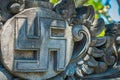 BALI, INDONESIA - MARCH 08, 2017: Nazi symbol carving over a wall concrete, that represent Hitler government, located in