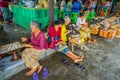 BALI, INDONESIA - MARCH 08, 2017: Women preparing an Indian Sadhu dough for chapati on Manmandir ghat on the banks of