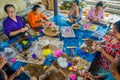 BALI, INDONESIA - MARCH 08, 2017: Women preparing an Indian Sadhu dough for chapati on Manmandir ghat on the banks of