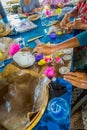 BALI, INDONESIA - MARCH 08, 2017: Women preparing an Indian Sadhu dough for chapati on Manmandir ghat on the banks of