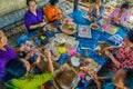 BALI, INDONESIA - MARCH 08, 2017: Women preparing an Indian Sadhu dough for chapati on Manmandir ghat on the banks of