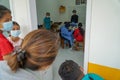 BALI/INDONESIA-MAY 28 2021: An ENT doctor is examining the ears, nose and throat of a pediatric patient. During the COVID-19