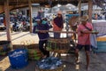 BALI/INDONESIA-MAY 15 2019:The fishermen`s catch is immediately weighed at the fish auction site. The catch of fishermen, placed Royalty Free Stock Photo