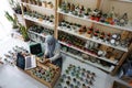 BALI/INDONESIA-MAY 25 2019: A Muslim businesswoman is selling succulent plants on internet. She has a clean and white workshop.