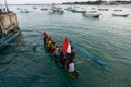 BALI/INDONESIA-MAY 15 2019: some people are in a traditional Indonesian-flagged boat. This traditional boat prepares to sail from