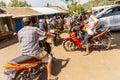 Road traffic on Bali. Many motorbikes wait at the crossroads.