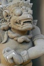 Bali, Indonesia. 8 OCT 2018. Scary looking traditional Bali island stone sculpture covered with beige dust