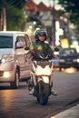 BALI, INDONESIA - OCTOBER 12, 2017: Scooters on the Legian street, Kuta, Bali, Indonesia. Motorbike traffic.