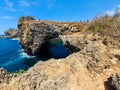 Bali,Indonesia- 01/15/2020 : People enjoying the great view of the blue water of Bali sea standing on the broken bridge in Nusa