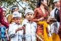 BALI, INDONESIA - SEPTEMBER 25, 2018: Balinese children in traditional clothes on a big ceremony in Tirta Empul Temple.