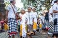 BALI, INDONESIA - SEPTEMBER 25, 2018: Balinese children in traditional clothes on a big ceremony in Tirta Empul Temple.