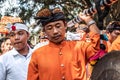 BALI, INDONESIA - SEPTEMBER 25, 2018: Balinese men in traditional clothes on a big ceremony in Tirta Empul Temple.