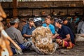 BALI, INDONESIA - SEPTEMBER 25, 2018: Balinese men in traditional clothes on a big ceremony in Tirta Empul Temple.