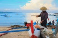 Local balinese repair his fishing net