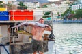 Bali, Island Crete, Greece, - June 30, 2016: Man is a fisherman carries a big fish sawfish