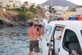 Bali, Island Crete, Greece, - June 30, 2016: Man is a fisherman carries a big fish sawfish