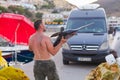 Bali, Island Crete, Greece, - June 30, 2016: Man is a fisherman carries a big fish sawfish