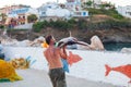 Bali, Island Crete, Greece, - June 30, 2016: Man is a fisherman carries a big fish sawfish