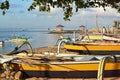 Bali Outrigger Fishing Boats on Sanur beach, Indonesia at dawn. Royalty Free Stock Photo
