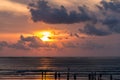 Bali sunset with people on beach