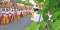 Bali temple festival procession on the street with many colorful of big offerings Royalty Free Stock Photo