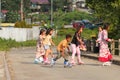 BALIKPAPAN, INDONESIA - July 25, 2021: Group of Southeast Asian kids playing in line skate in unused bridge.