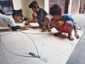 Balinese Boys Making a Traditional Kite Royalty Free Stock Photo