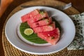 Balinese breakfast served in a white plate with watermelon and lemon piece