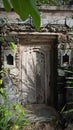 Balinese carved wooden door in an old abandoned building