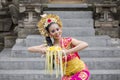 Balinese dancer dancing while carrying flower Royalty Free Stock Photo