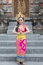 Balinese dancer shows welcome gesture in temple Royalty Free Stock Photo
