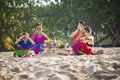 Balinese family prayed in front of Kuta Beach, Bali, Indonesia.