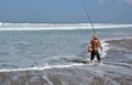 Balinese Fisherman Surf Casting on Legian Beach.