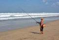 Balinese Fisherman Surf Casting on Legian Beach.