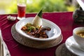 Balinese grilled prawn served with traditional cone shaped leave wrapped rice and vegetables