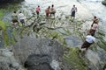 Balinese Hindu devotees pray at sunset.