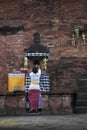 A Balinese Hindu woman is praying