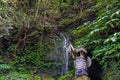 Balinese house of spirits with sacred waterfall wall on background Royalty Free Stock Photo