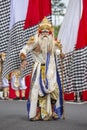 Balinese man, wearing a Hanuman mask, participates in a street ceremony in island Bali, Indonesia