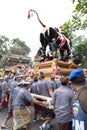 Balinese men carry the black bull sarcophagus during a procession for `Ngaben`, a cremation ceremony at Ubud, Bali, 2nd March 2018