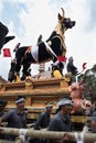 Balinese men carry the black bull sarcophagus during a procession for `Ngaben`, a cremation ceremony at Ubud, Bali, 2nd March 2018