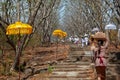 Balinese people carry traditional religious offering to temple for ceremony Royalty Free Stock Photo