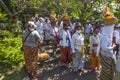 Balinese people dressed in traditional clothing at a temple Ceremony in Bali.