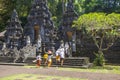 Balinese people dressed in traditional clothing at a temple Ceremony in Bali.