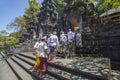 Balinese people dressed in traditional clothing at a temple Ceremony in Bali.