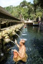 Balinese people praying at holy spring water at Pura Tirtha Empul