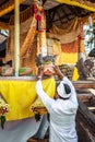 Balinese people praying on a traditional ceremony. Bali island.